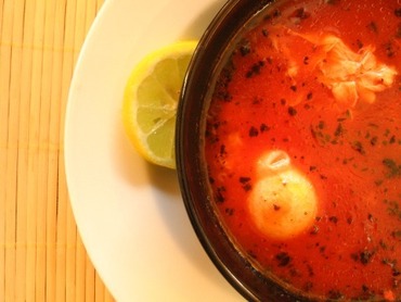 Tomato and rice soup with poached eggs